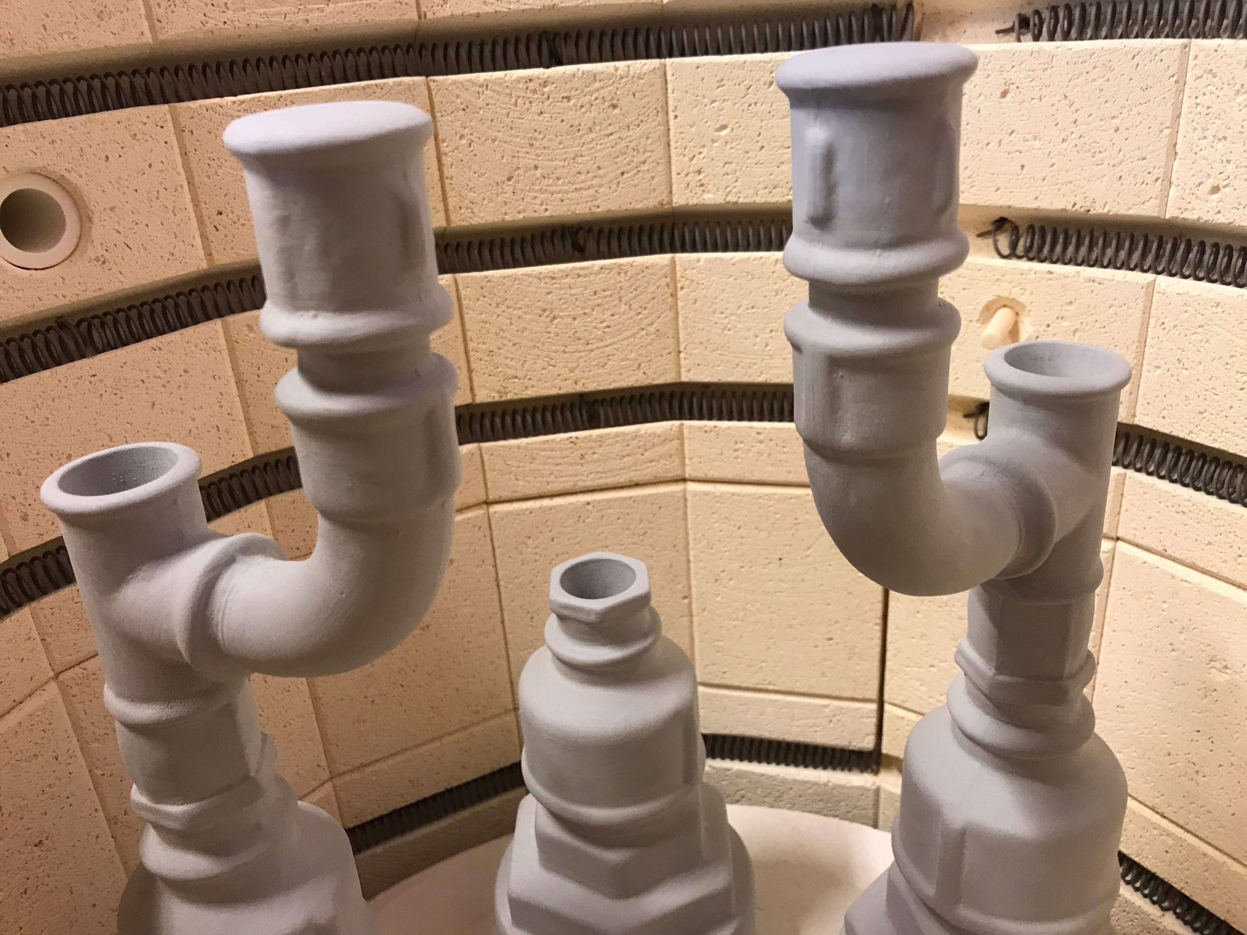Triple candleholders fresh from the kiln