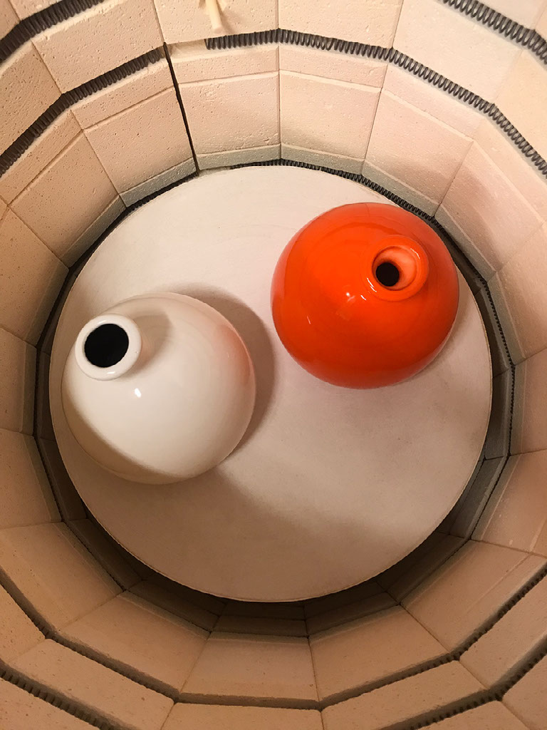 White and orange vase duo, top view