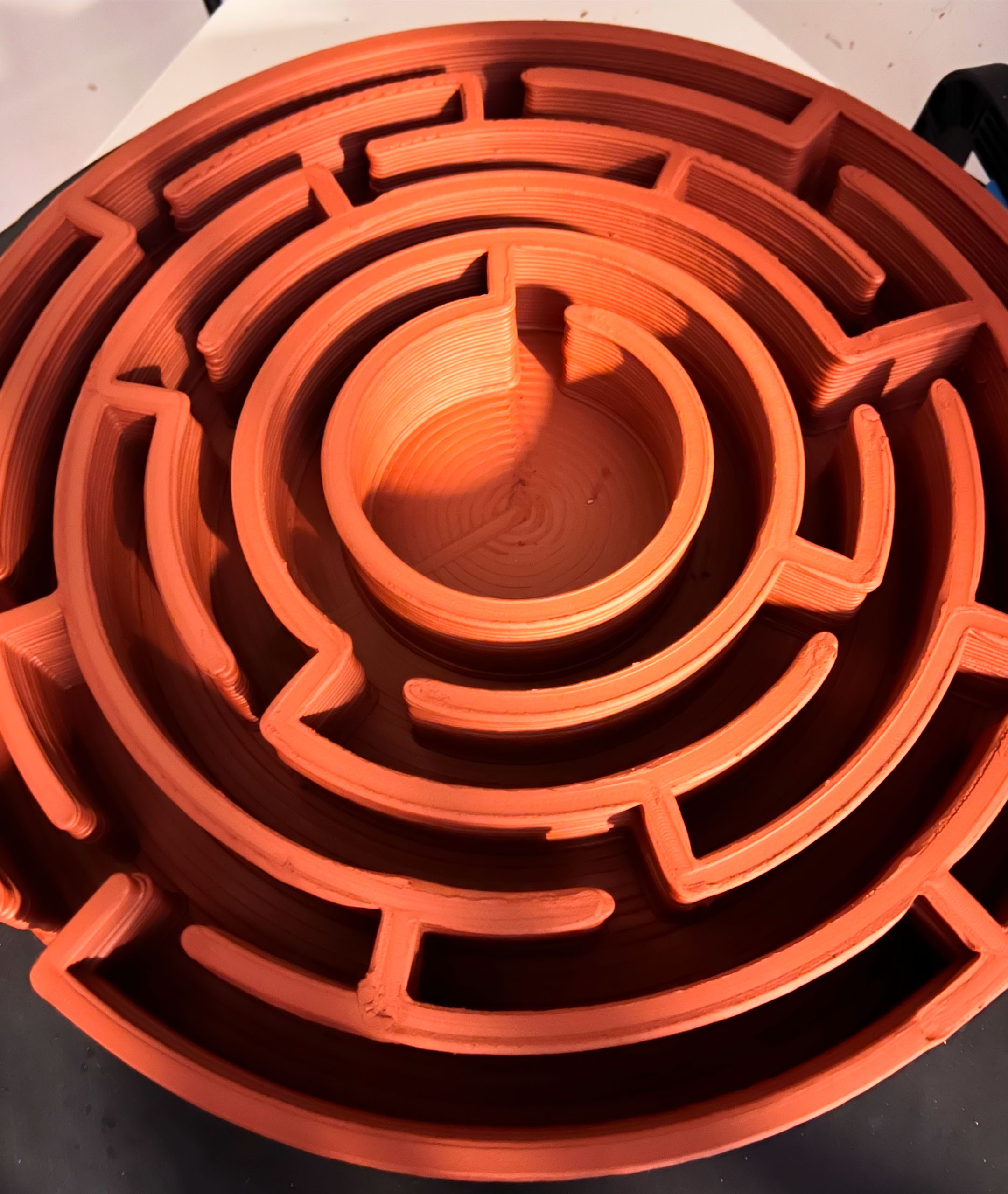 3D printed Maze-R — terracotta concentric labyrinth, top view